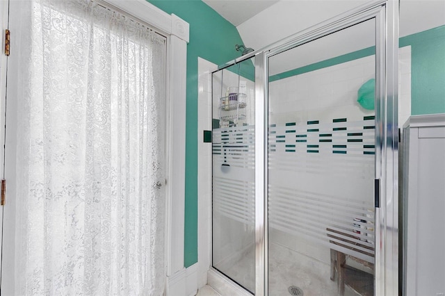 bathroom with a shower stall