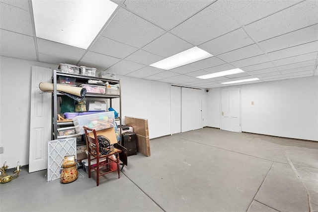 finished basement featuring a drop ceiling