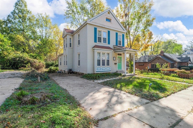 view of front of home with a front lawn