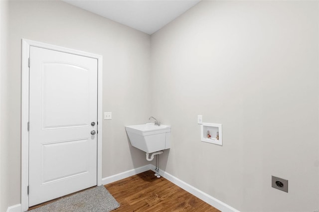 laundry room featuring laundry area, washer hookup, wood finished floors, baseboards, and electric dryer hookup