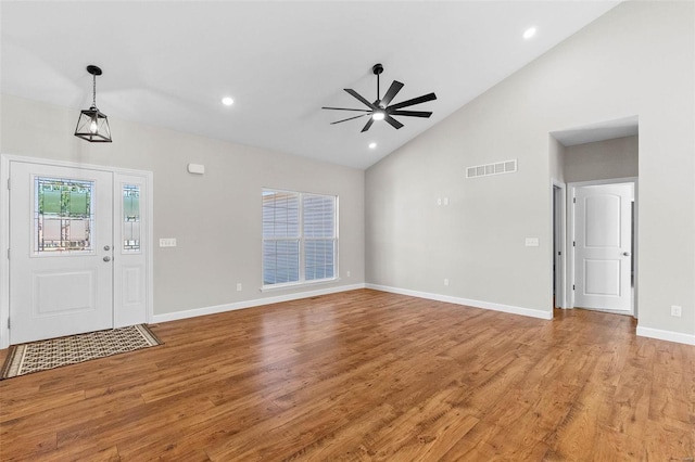 foyer with light wood-style floors, baseboards, visible vents, and ceiling fan