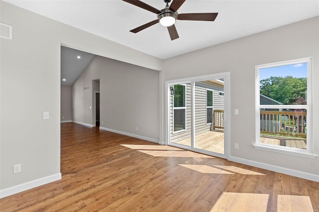 unfurnished room with a ceiling fan, baseboards, and wood finished floors