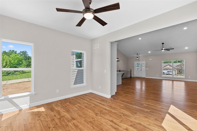 unfurnished living room with light wood-style floors, baseboards, visible vents, and recessed lighting