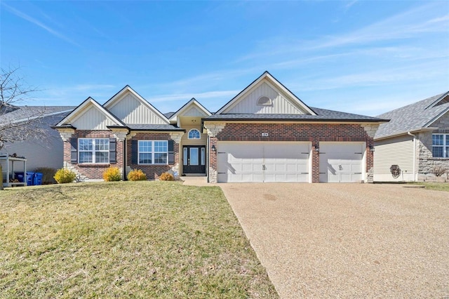 view of front of home featuring a front yard, an attached garage, brick siding, and driveway