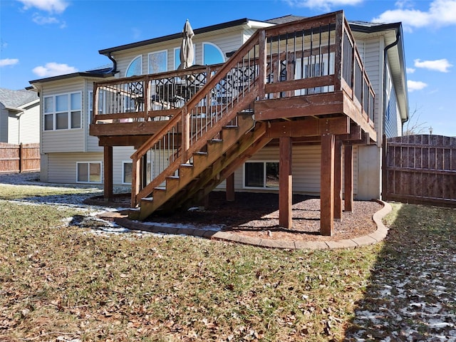 back of house with stairs, fence, and a wooden deck