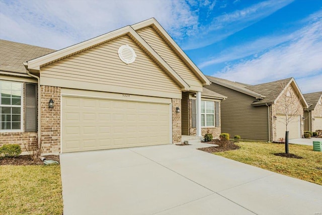 ranch-style home featuring a garage, driveway, and brick siding