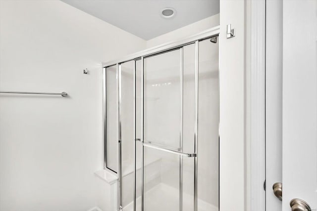 bathroom with a shower stall