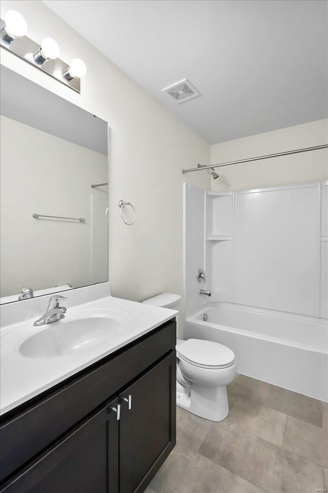 bathroom with visible vents, shower / bathing tub combination, vanity, and toilet