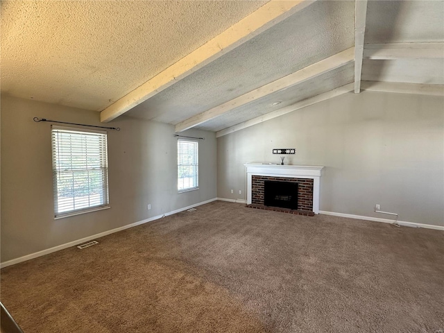 unfurnished living room featuring a textured ceiling, carpet, visible vents, and baseboards