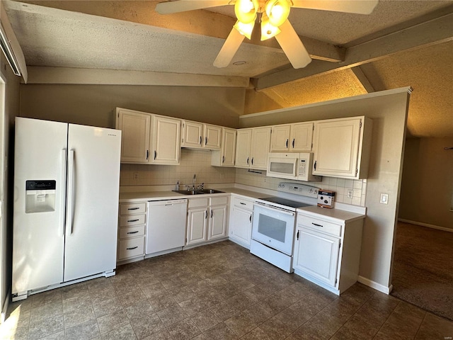 kitchen featuring lofted ceiling, light countertops, white cabinetry, a sink, and white appliances