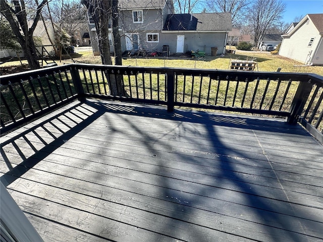 deck with a yard and a residential view