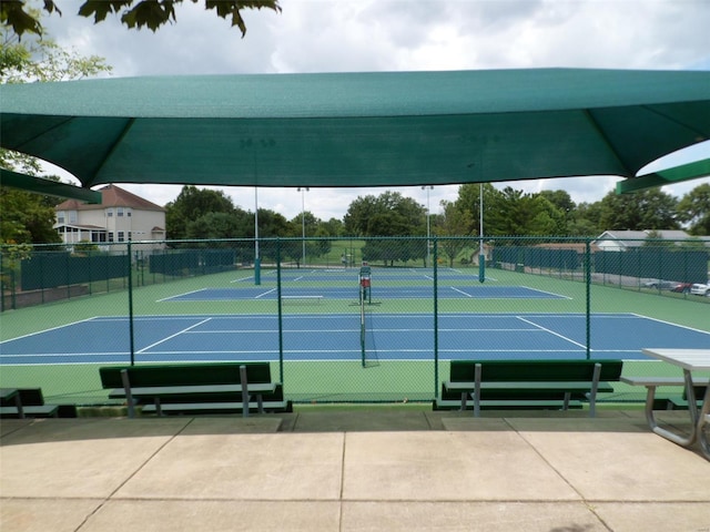 view of sport court with fence