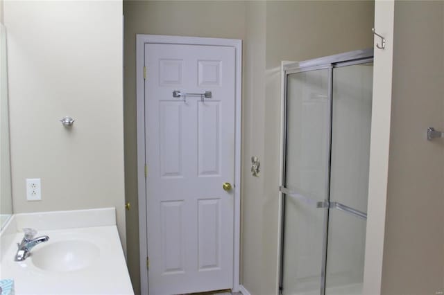 full bath featuring a stall shower and vanity