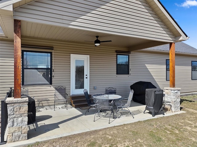 view of patio with grilling area, entry steps, and ceiling fan