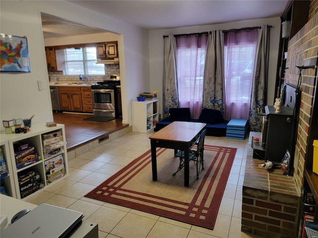 living area featuring light tile patterned flooring