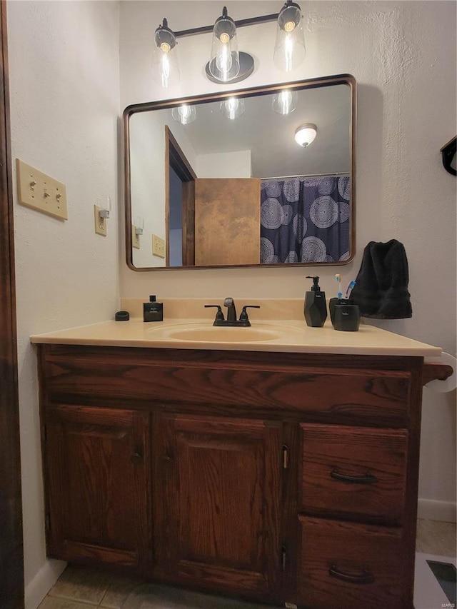 bathroom with vanity and tile patterned floors