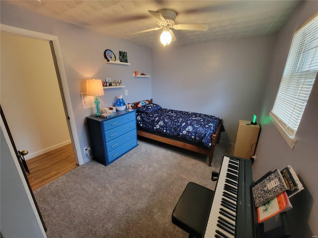 bedroom featuring ceiling fan and carpet flooring