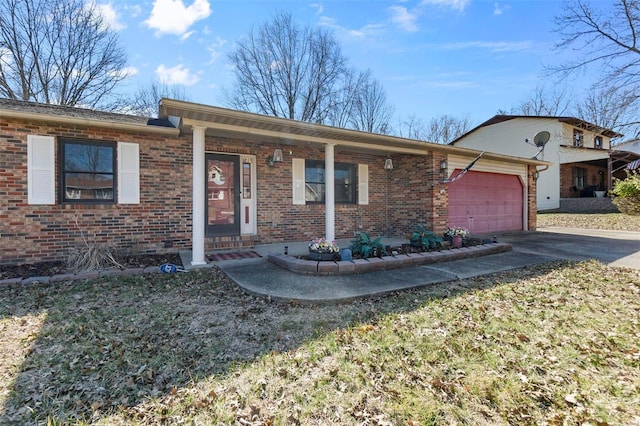 ranch-style house featuring driveway, a garage, and brick siding