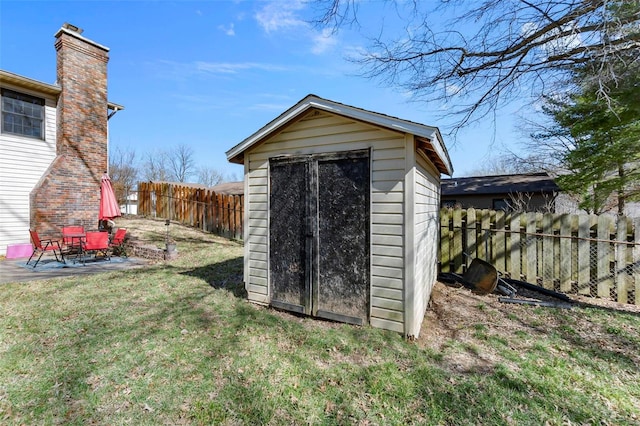 view of shed featuring a fenced backyard