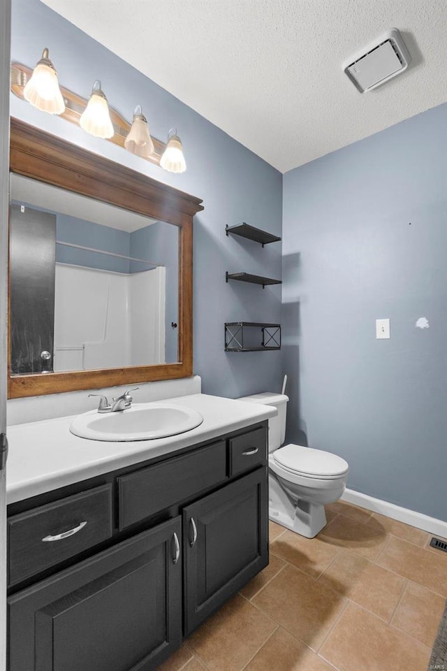 bathroom with a textured ceiling, tile patterned flooring, toilet, visible vents, and vanity