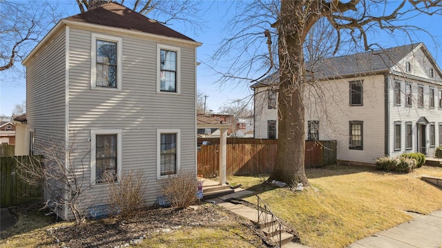 view of home's exterior with fence