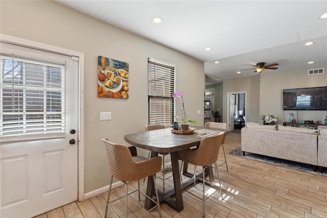 dining area featuring baseboards, visible vents, wood finish floors, recessed lighting, and ceiling fan