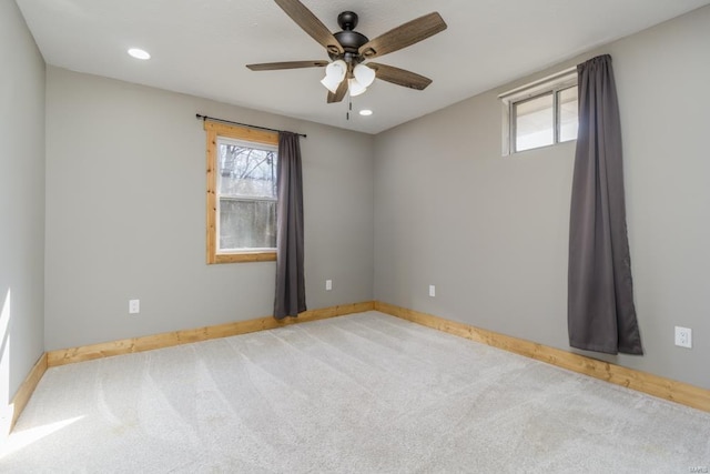 empty room featuring baseboards, recessed lighting, carpet flooring, and a healthy amount of sunlight