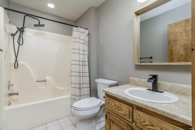 full bath with toilet, tile patterned flooring, shower / tub combo with curtain, and vanity