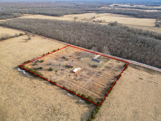 birds eye view of property with a rural view