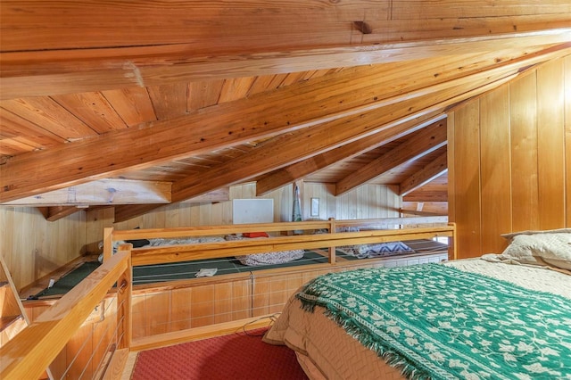 bedroom with wooden ceiling, beamed ceiling, and wooden walls