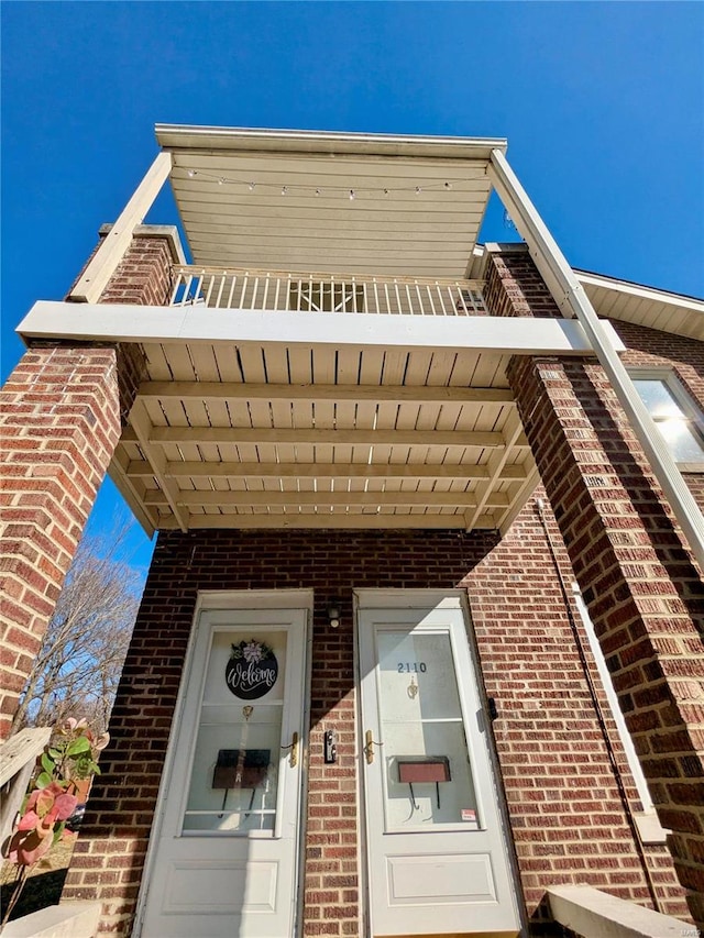 exterior space with brick siding