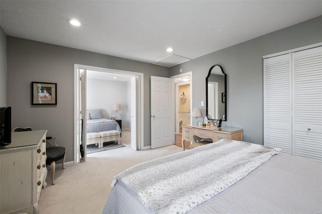 bedroom featuring baseboards, a closet, recessed lighting, and light colored carpet