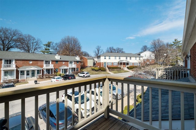 wooden deck with a residential view