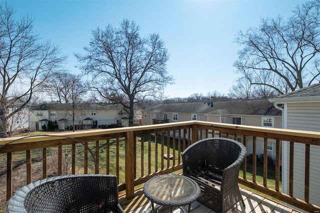 wooden terrace with a residential view