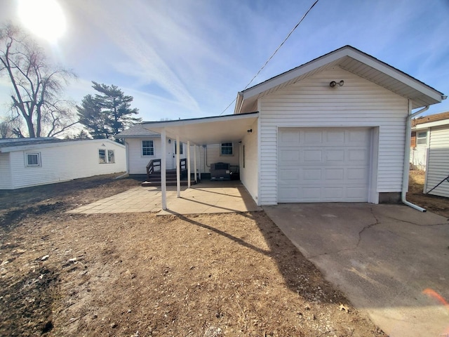 exterior space featuring a carport and driveway