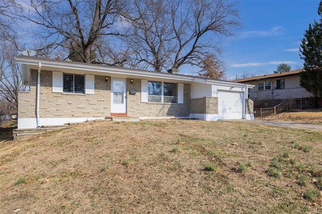 ranch-style home with driveway, stone siding, an attached garage, fence, and a front yard