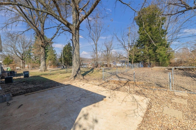 view of yard with fence and a patio