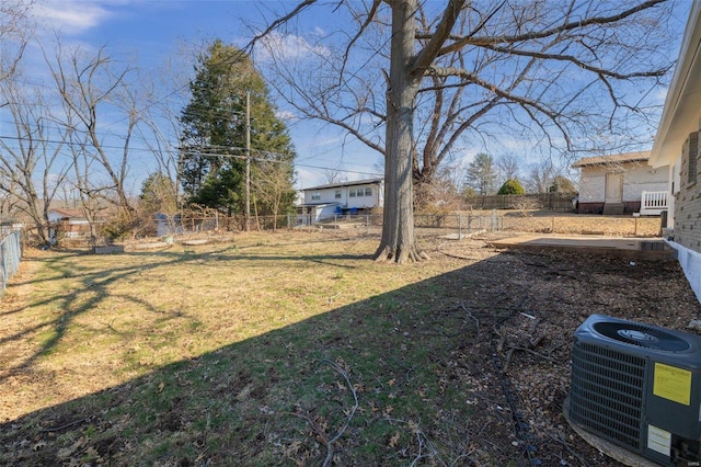 view of yard with a fenced backyard and cooling unit