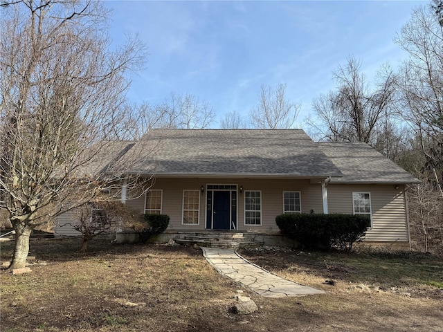 view of front of property featuring a shingled roof