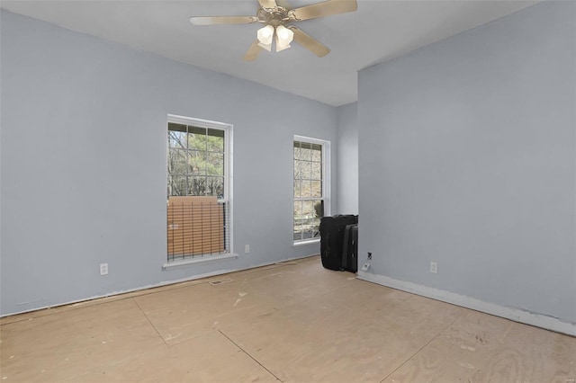 spare room with visible vents and ceiling fan