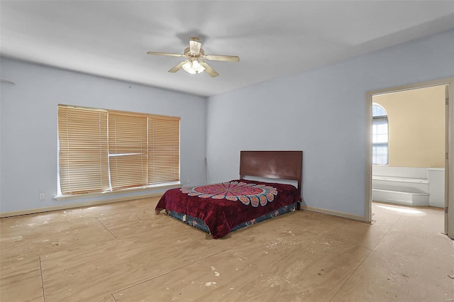 bedroom featuring baseboards and ceiling fan