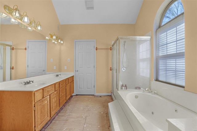 full bathroom featuring a shower stall, lofted ceiling, and a whirlpool tub