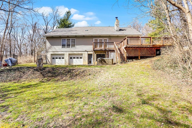 back of property featuring stairway, a yard, a wooden deck, a garage, and a chimney