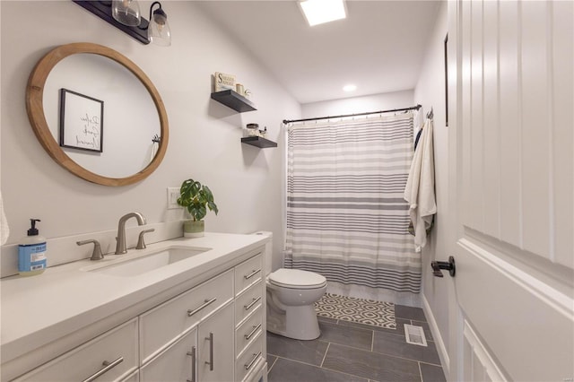 full bath with visible vents, toilet, curtained shower, tile patterned flooring, and vanity