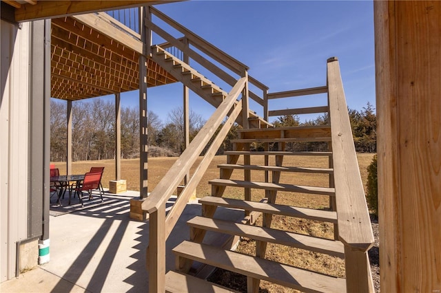 view of patio / terrace with stairs and outdoor dining area