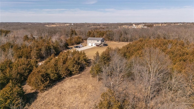 bird's eye view featuring a wooded view