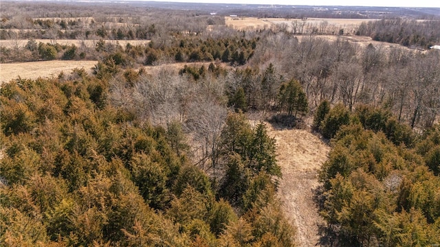 aerial view featuring a wooded view