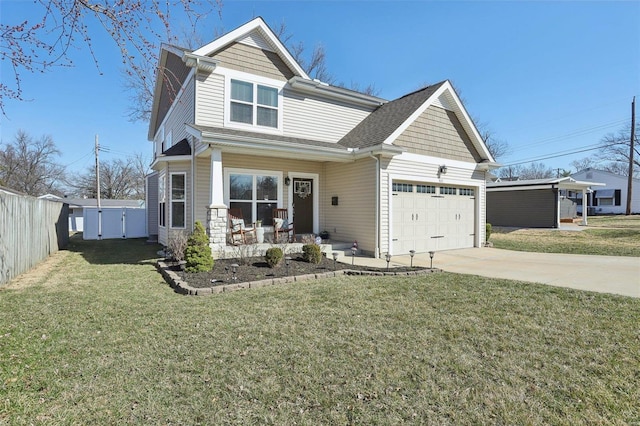 view of front facade featuring concrete driveway, an attached garage, fence, and a front yard