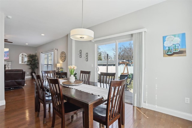 dining area featuring recessed lighting, baseboards, and wood finished floors