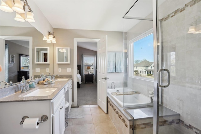 full bathroom featuring tile patterned floors, a shower stall, a bath, and a sink